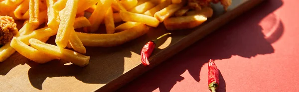 Spicy French Fries Served Wooden Cutting Board Chili Peppers Sunlight — Stock Photo, Image