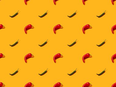 red spicy chili peppers and jalapenos on orange colorful background, seamless pattern clipart