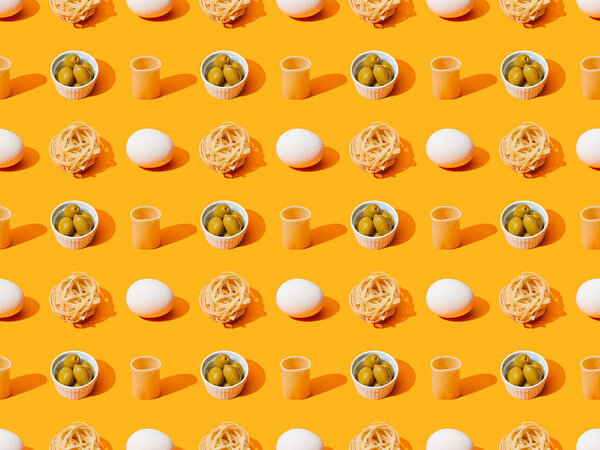 fresh white chicken eggs, pasta and olives on orange colorful background, seamless pattern