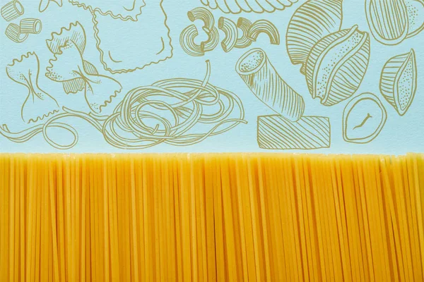 Vista Superior Espaguetis Crudos Sobre Fondo Azul Con Ilustración Pasta — Foto de Stock