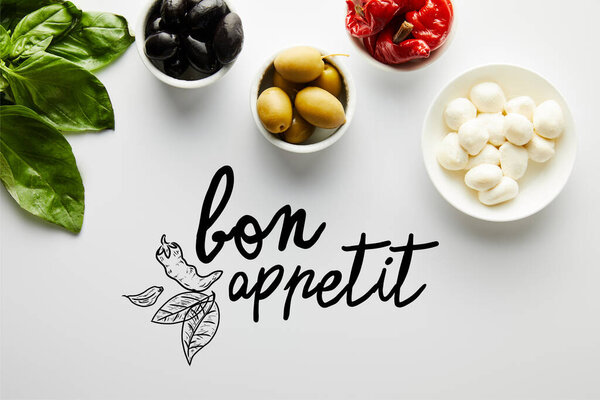 Top view of basil leaves and bowls with ingredients on white, bon appetit illustration