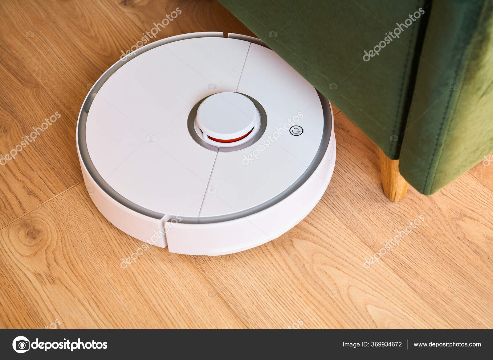 Modern Automatic Vacuum Cleaner Washing Floor Green Sofa ⬇ Stock Photo
