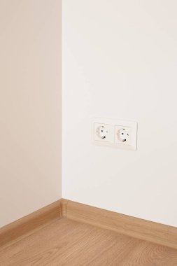 modern power sockets on wall in apartment  clipart