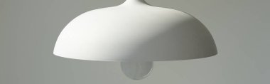 panoramic crop of white and modern lamp with light bulb clipart