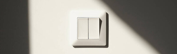 horizontal image of white switch on wall in apartment 