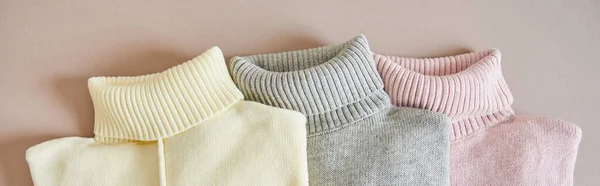 Top View Pink Beige Grey Knitted Soft Sweaters Panoramic Shot — Stock Photo, Image