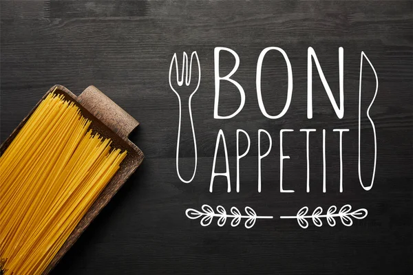 Top View Raw Spaghetti Black Wooden Background Bon Appetit Illustration — Stock Photo, Image