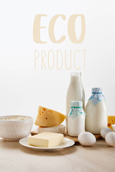 various fresh organic dairy products and eggs on wooden table isolated on white with eco product illustration