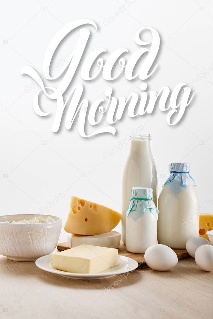 various fresh organic dairy products and eggs on wooden table isolated on white, good morning illustration