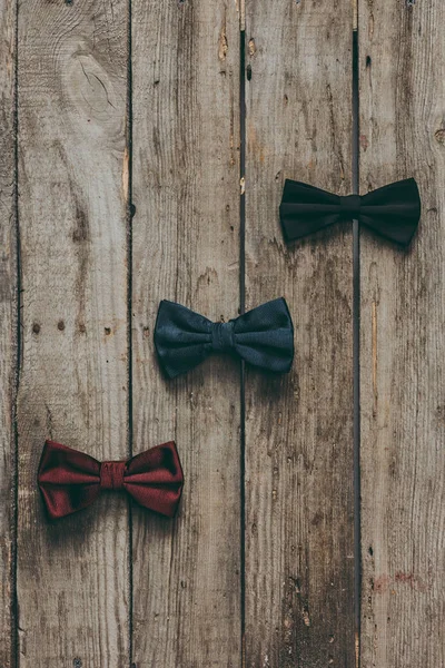 Classic bow ties on wooden tabletop — Stock Photo