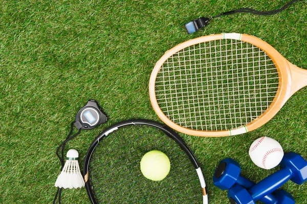 Sport equipment on grass — Stock Photo