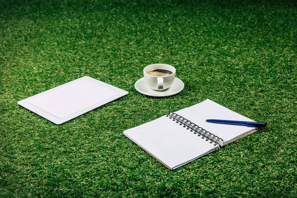 Tablet and blank notebook — Stock Photo