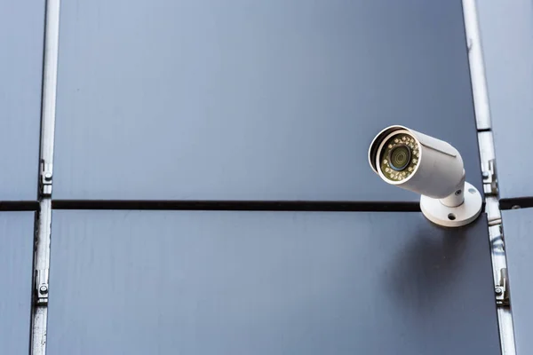 Security camera on wall — Stock Photo