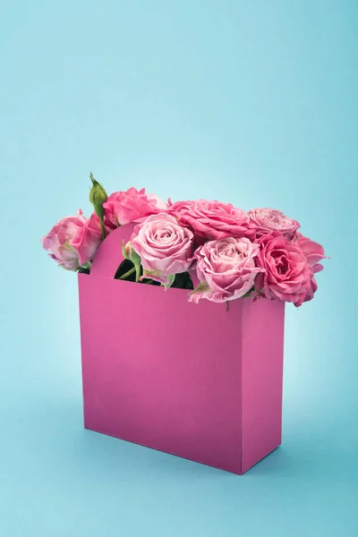 Pink roses in paper box — Stock Photo