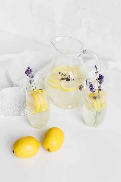 Lemonade in glasses and jar — Stock Photo