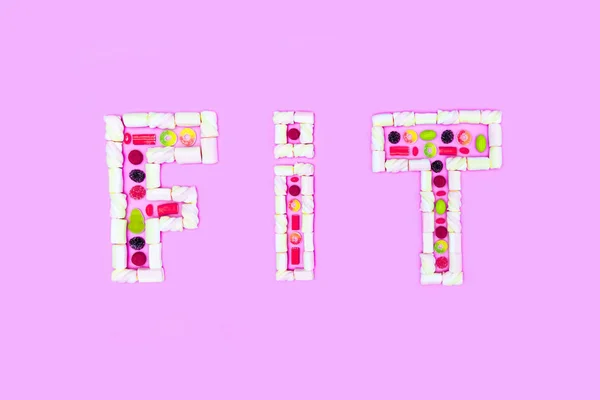 Fit word made of sweets — Stock Photo