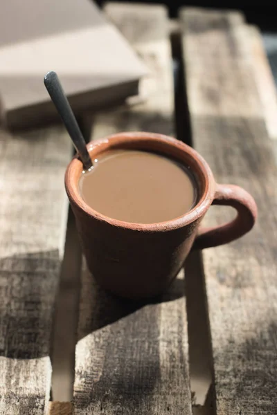 Clay cup of coffee with milk — Stock Photo