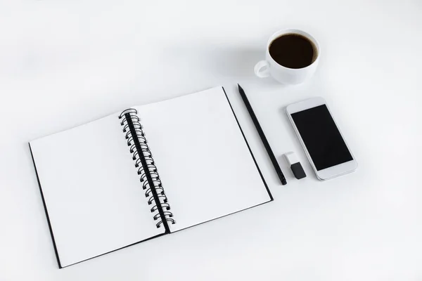 Empty notepad and smartphone — Stock Photo