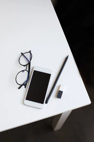 Top view of cup of smartphone with blank screen — Stock Photo