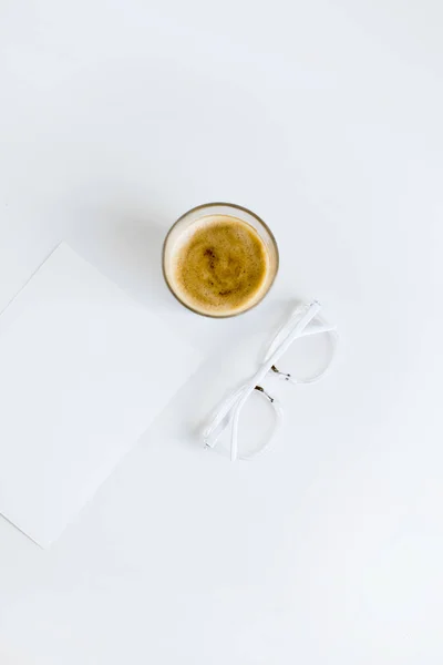 Cup of coffee with paper — Stock Photo