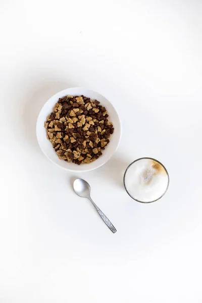 Glass of coffee and cornflakes — Stock Photo