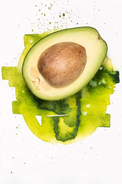 Avocado with watercolor stains — Stock Photo