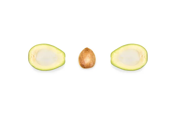 Halves of avocado and seed — Stock Photo