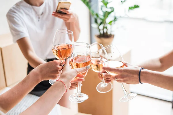 Women clinking with wineglasses — Stock Photo