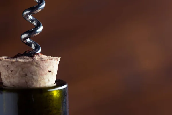 Wine bottle with corkscrew — Stock Photo