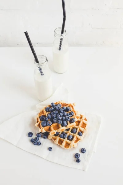 Waffles with blueberries and milk — Stock Photo