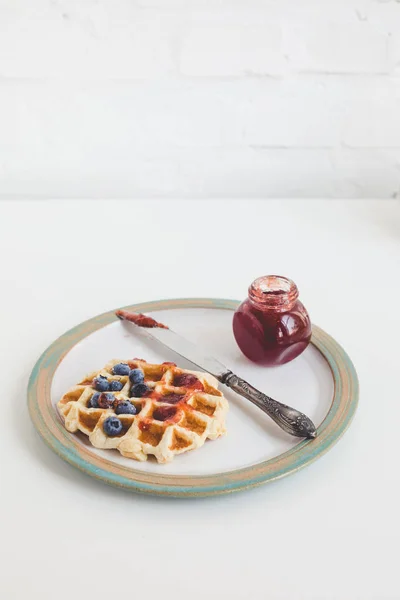 Waffle with jam on plate — Stock Photo