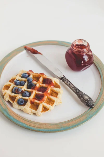 Waffle with jam on plate — Stock Photo