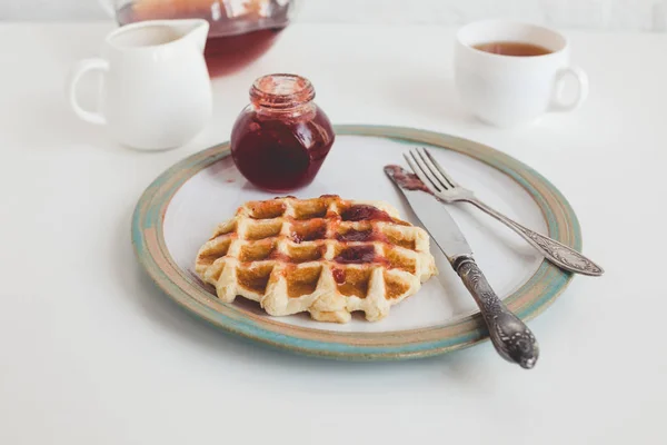Waffle with jam on plate — Stock Photo