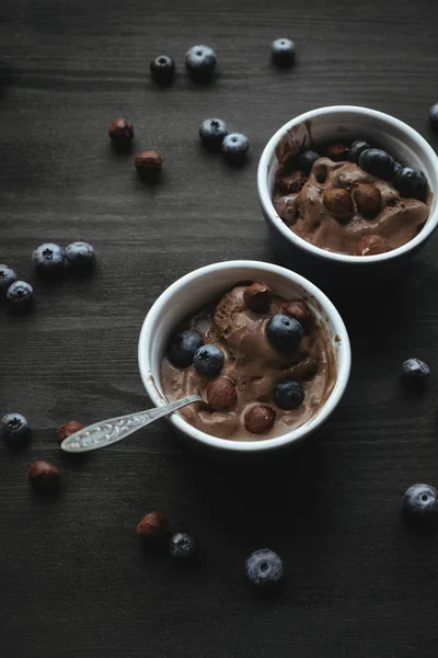 Ice cream with blueberries and hazelnuts — Stock Photo