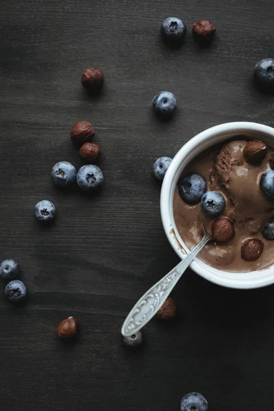 Ice cream with blueberries and hazelnuts — Stock Photo