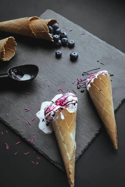 Ice cream with topping and blueberries — Stock Photo