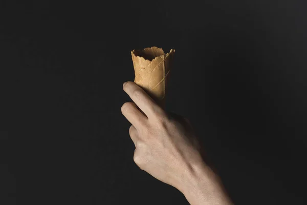 Hand holding wafer cone — Stock Photo