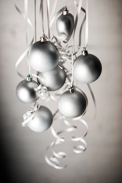 Christmas balls on ribbons — Stock Photo