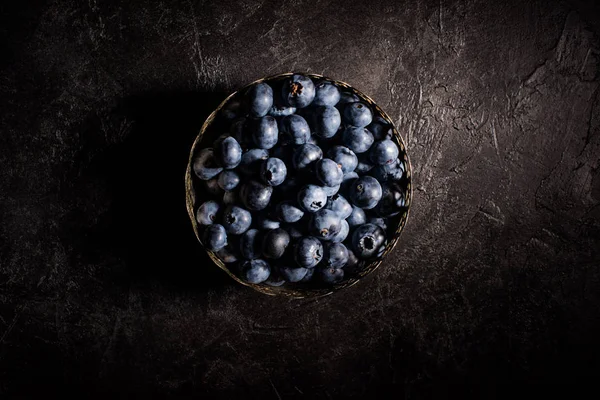 Blueberries in vintage bowl — Stock Photo