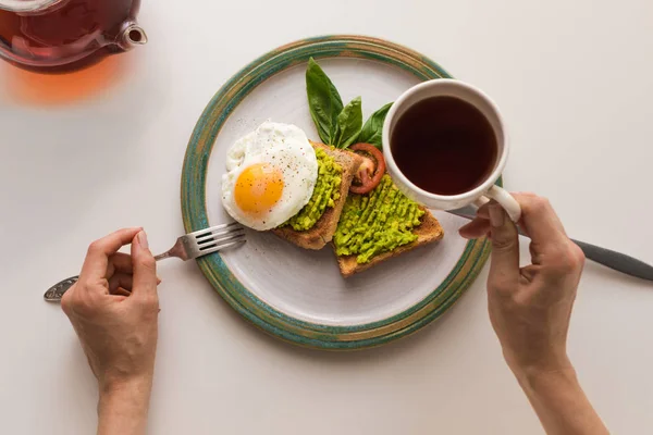Breakfast with tea and toasts — Stock Photo