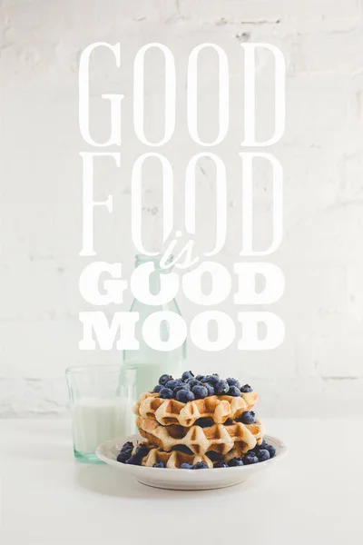 Waffles with blueberries and milk — Stock Photo