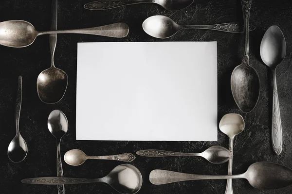 Rustic spoons and blank paper — Stock Photo