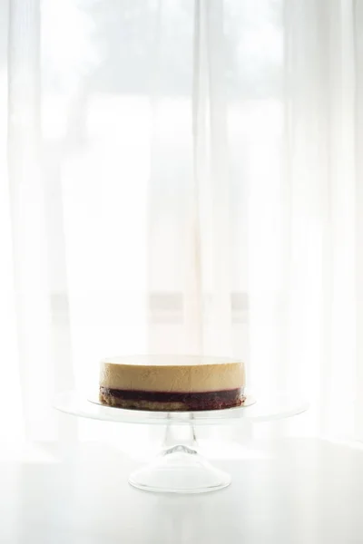 Delicious cheesecake on stand — Stock Photo
