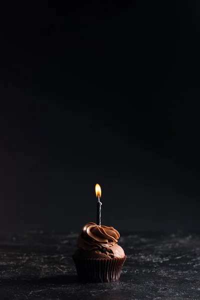 Chocolate cupcake with candle — Stock Photo