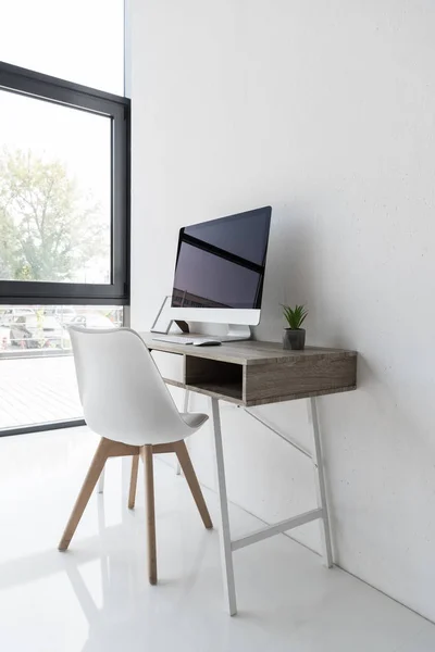 Workplace with computer in modern office — Stock Photo