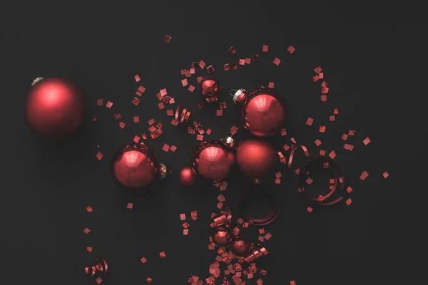 Christmas balls and confetti — Stock Photo