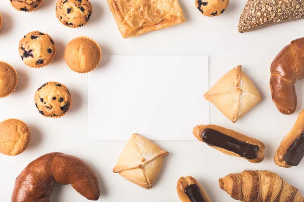 Various types of pastry and blank card — Stock Photo