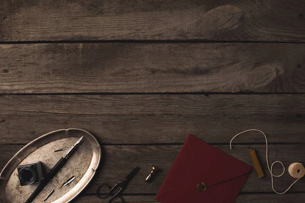 Red envelope and decorative tools — Stock Photo