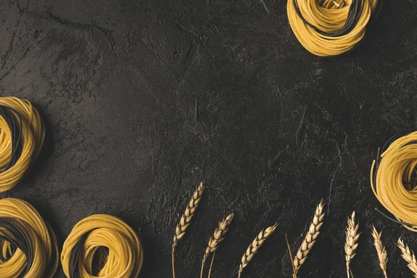 Raw pasta and wheat frame — Stock Photo