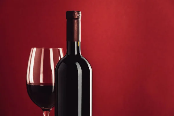 Red wine in glass and bottle — Stock Photo